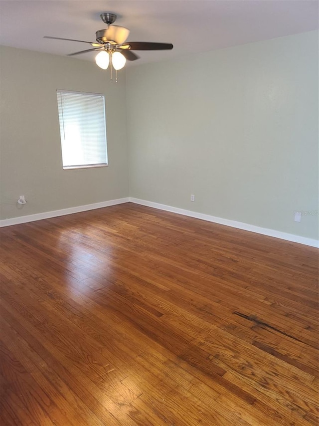 548 3rd St N, Saint Petersburg, FL 33701 - empty room with ceiling fan, baseboards, and wood finished floors