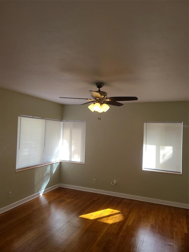 548 3rd St N, Saint Petersburg, FL 33701 - unfurnished room featuring baseboards, ceiling fan, and wood finished floors