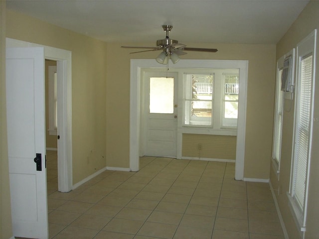 548 3rd St N, Saint Petersburg, FL 33701 - foyer with light tile patterned floors, baseboards, and a ceiling fan