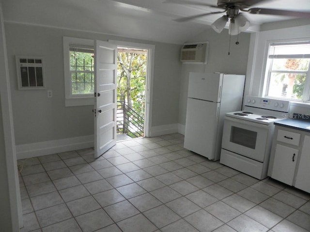 548 3rd St N, Saint Petersburg, FL 33701 - kitchen featuring white appliances, light tile patterned floors, a ceiling fan, white cabinets, and a wall unit AC