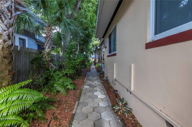 548 3rd St N, Saint Petersburg, FL 33701 - view of side of property with stucco siding and fence