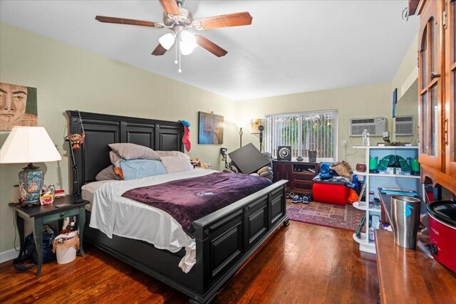 548 3rd St N, Saint Petersburg, FL 33701 - bedroom with a ceiling fan, wood finished floors, and a wall mounted air conditioner