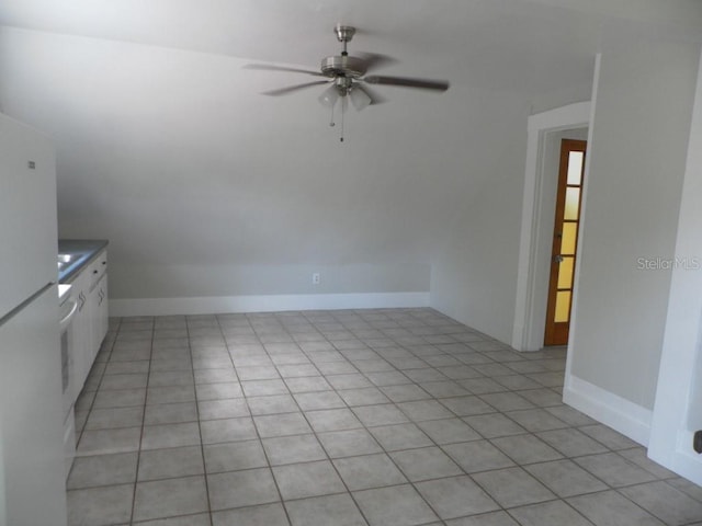 548 3rd St N, Saint Petersburg, FL 33701 - spare room featuring ceiling fan, baseboards, and lofted ceiling