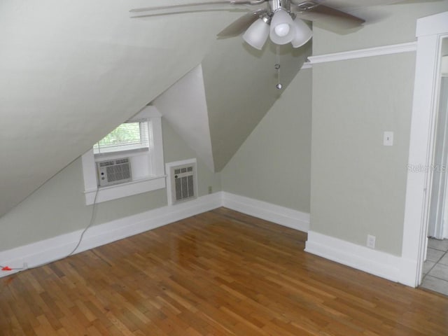 548 3rd St N, Saint Petersburg, FL 33701 - additional living space featuring ceiling fan, cooling unit, vaulted ceiling, wood finished floors, and baseboards