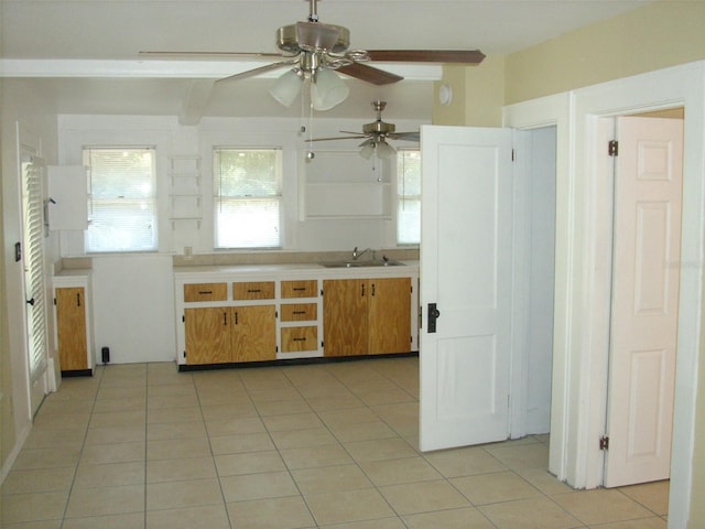 548 3rd St N, Saint Petersburg, FL 33701 - kitchen with a sink, light countertops, ceiling fan, and light tile patterned flooring