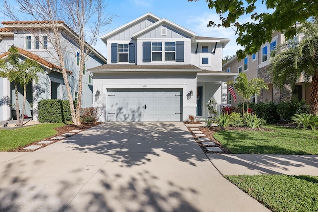 14241 Natures Reserve Dr, Lithia, FL 33547 - view of front of home featuring board and batten siding, an attached garage, concrete driveway, and stucco siding