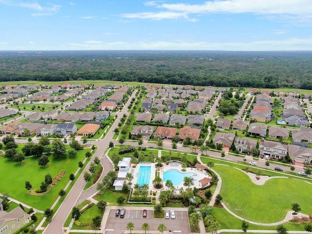 14241 Natures Reserve Dr, Lithia, FL 33547 - aerial view of property and surrounding area with a pool area, nearby suburban area, and a heavily wooded area