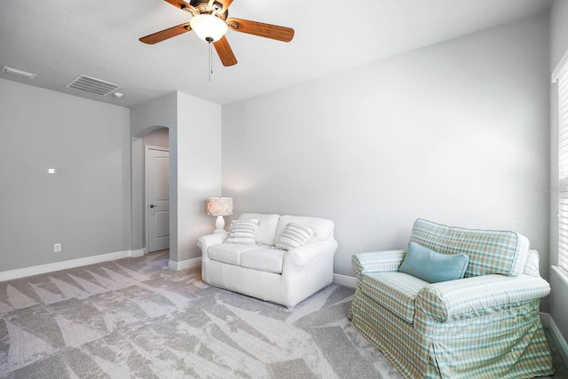 14241 Natures Reserve Dr, Lithia, FL 33547 - sitting room featuring arched walkways, a ceiling fan, carpet, and baseboards