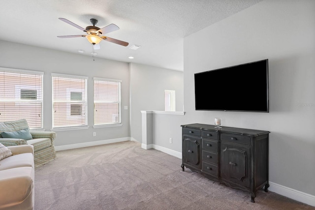 14241 Natures Reserve Dr, Lithia, FL 33547 - living area with a ceiling fan, light colored carpet, and baseboards