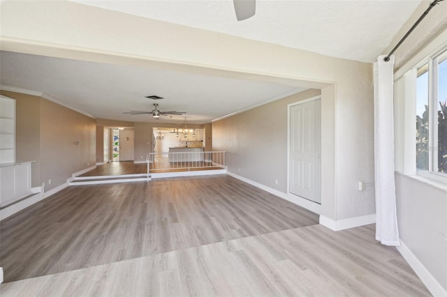 3252 Scorecard Dr, New Port Richey, FL 34655 - unfurnished living room with a wealth of natural light, a ceiling fan, and baseboards