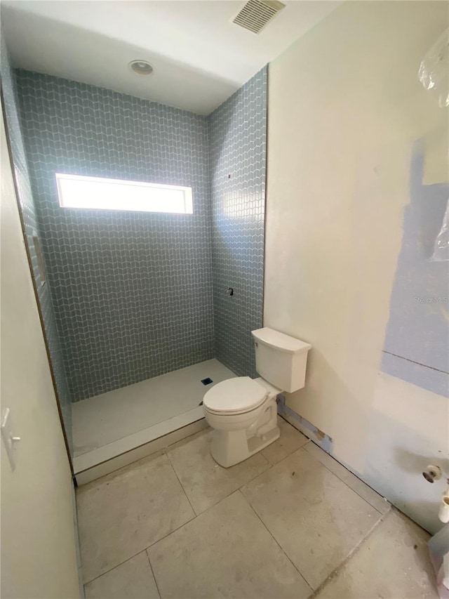 27 Kingfish St, Santa Rosa Beach, FL 32459 - full bathroom with visible vents, toilet, tile patterned floors, and tiled shower
