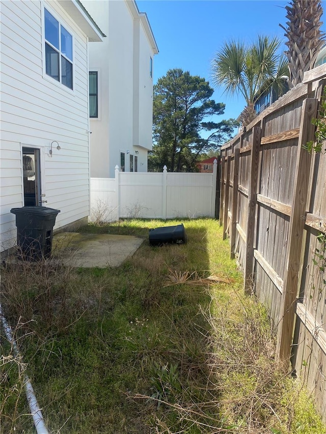 27 Kingfish St, Santa Rosa Beach, FL 32459 - view of yard featuring a patio and a fenced backyard
