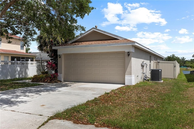 10108 36th Ct E, Parrish, FL 34219 - view of front of house with stucco siding, driveway, and an attached garage