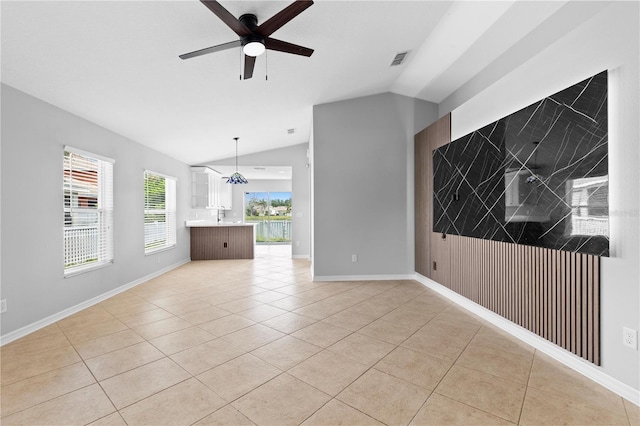 10108 36th Ct E, Parrish, FL 34219 - unfurnished living room with lofted ceiling, light tile patterned floors, and a ceiling fan