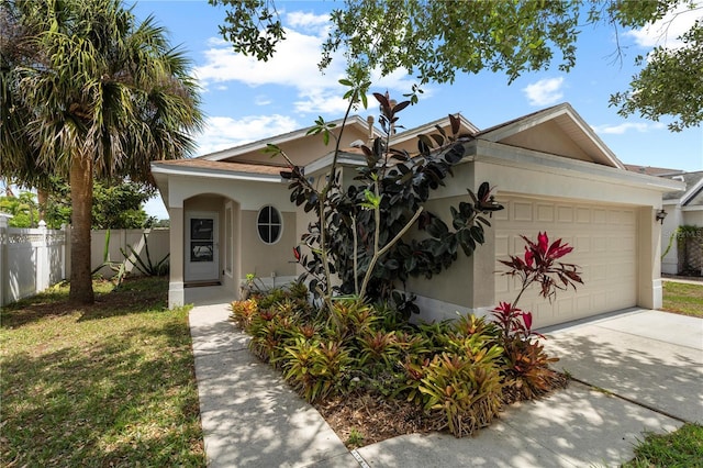10108 36th Ct E, Parrish, FL 34219 - view of front of house with a garage, stucco siding, and concrete driveway