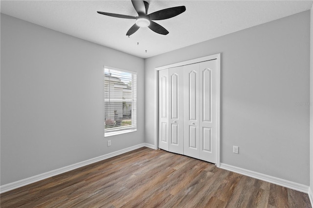 10108 36th Ct E, Parrish, FL 34219 - unfurnished bedroom with wood finished floors, a closet, and ceiling fan