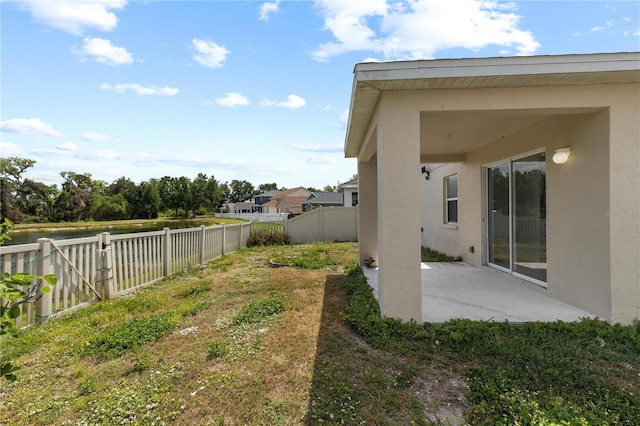 10108 36th Ct E, Parrish, FL 34219 - fenced backyard with a patio area