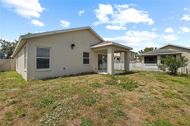 10108 36th Ct E, Parrish, FL 34219 - rear view of property with stucco siding