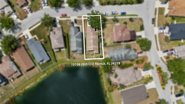 10108 36th Ct E, Parrish, FL 34219 - aerial view of residential area featuring property boundaries highlighted and a large body of water