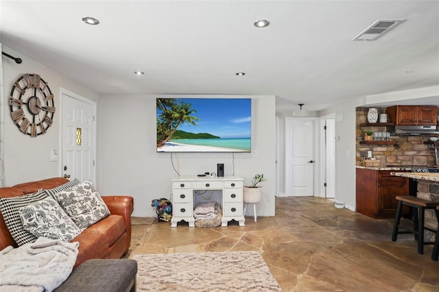9825 Casey Dr, New Port Richey, FL 34654 - living area featuring recessed lighting, stone finish flooring, and visible vents