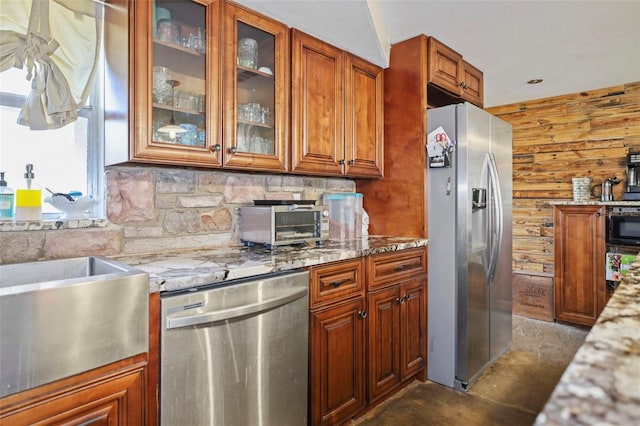 9825 Casey Dr, New Port Richey, FL 34654 - kitchen featuring decorative backsplash, light stone countertops, stainless steel appliances, glass insert cabinets, and brown cabinetry