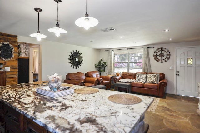 9825 Casey Dr, New Port Richey, FL 34654 - dining space featuring visible vents, recessed lighting, and stone finish flooring