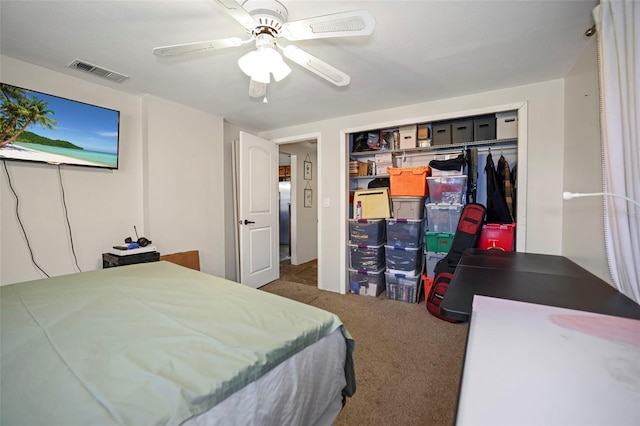 9825 Casey Dr, New Port Richey, FL 34654 - bedroom featuring visible vents, a closet, carpet, and a ceiling fan