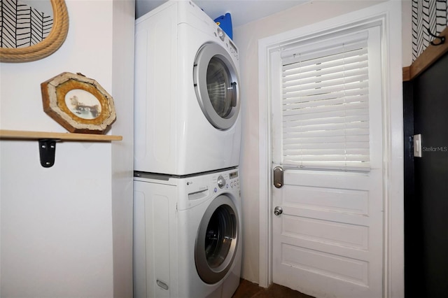 9825 Casey Dr, New Port Richey, FL 34654 - clothes washing area with stacked washer and dryer