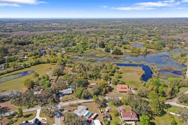 9825 Casey Dr, New Port Richey, FL 34654 - birds eye view of property with a water view and a forest view
