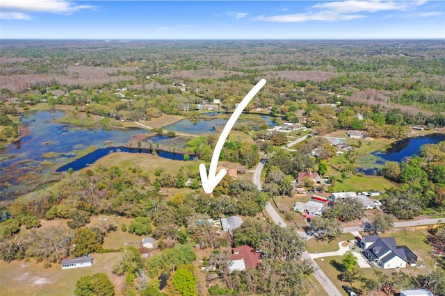 9825 Casey Dr, New Port Richey, FL 34654 - bird's eye view featuring a water view and a wooded view