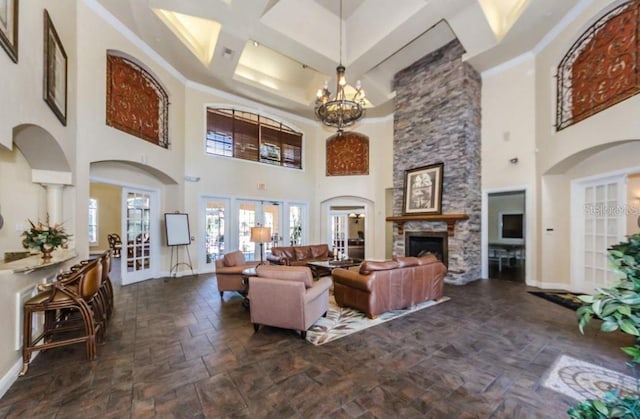 2220 Chianti Pl Unit 8-0817, Palm Harbor, FL 34683 - living area with a high ceiling, baseboards, beamed ceiling, a stone fireplace, and dark stone finish floors