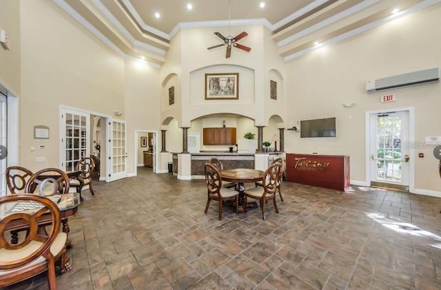 2220 Chianti Pl Unit 8-0817, Palm Harbor, FL 34683 - dining room featuring stone tile floors, a wall unit AC, crown molding, french doors, and a ceiling fan