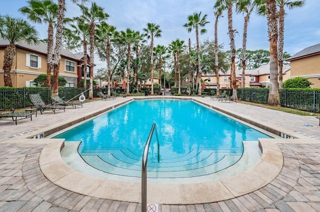 2220 Chianti Pl Unit 8-0817, Palm Harbor, FL 34683 - community pool featuring a patio area and a residential view
