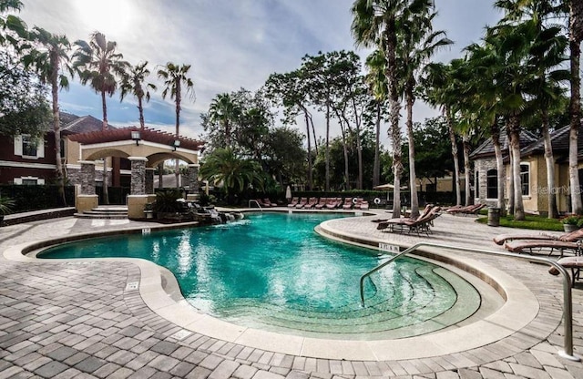 2220 Chianti Pl Unit 8-0817, Palm Harbor, FL 34683 - community pool featuring a patio area