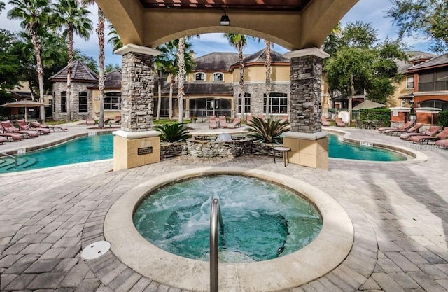 2220 Chianti Pl Unit 8-0817, Palm Harbor, FL 34683 - community pool with a hot tub and a patio area