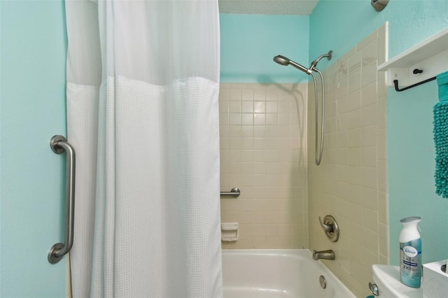 full bathroom featuring shower / bath combo and toilet