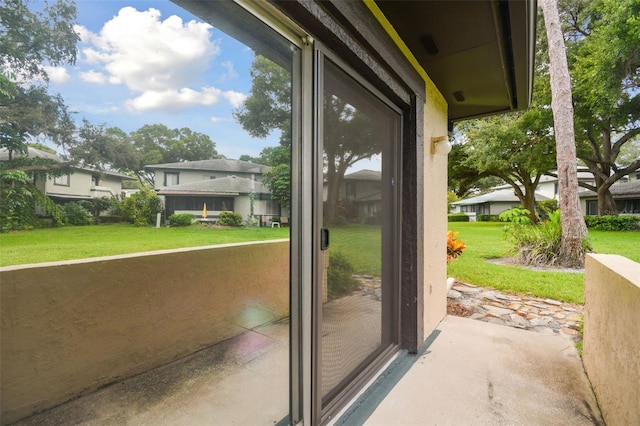 doorway to outside featuring a residential view