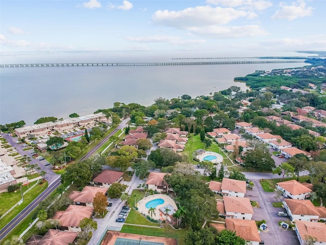 drone / aerial view with a residential view and a water view