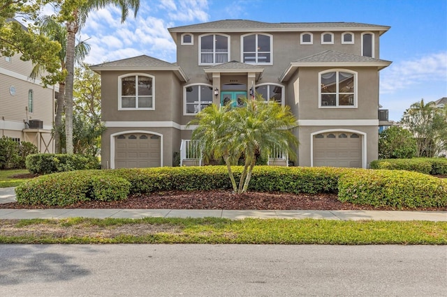2050 N Pointe Alexis Dr, Tarpon Springs, FL 34689 - view of front of house featuring stucco siding and a garage