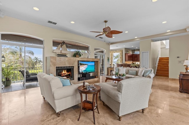 2050 N Pointe Alexis Dr, Tarpon Springs, FL 34689 - living room with visible vents, a tile fireplace, stairs, ceiling fan, and recessed lighting