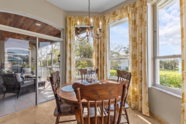 2050 N Pointe Alexis Dr, Tarpon Springs, FL 34689 - dining room with an inviting chandelier and baseboards