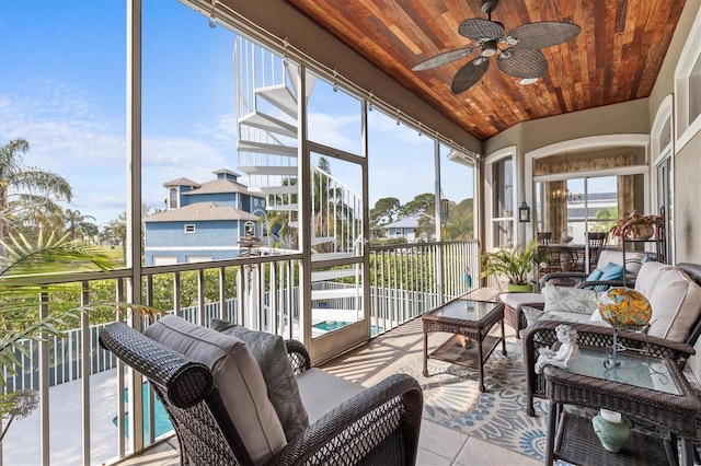 2050 N Pointe Alexis Dr, Tarpon Springs, FL 34689 - sunroom with a ceiling fan, wood ceiling, tile patterned floors, and an outdoor living space