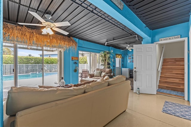 2050 N Pointe Alexis Dr, Tarpon Springs, FL 34689 - living area featuring stairs, ceiling fan, and speckled floor