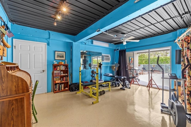 2050 N Pointe Alexis Dr, Tarpon Springs, FL 34689 - exercise room featuring a wall mounted air conditioner and a ceiling fan