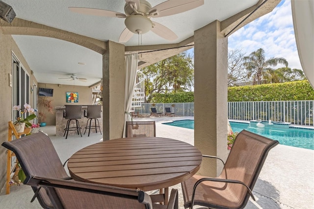 2050 N Pointe Alexis Dr, Tarpon Springs, FL 34689 - view of patio / terrace featuring ceiling fan, a fenced backyard, outdoor dining space, and stairway