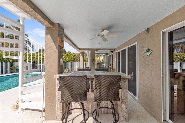 2050 N Pointe Alexis Dr, Tarpon Springs, FL 34689 - view of patio with a fenced in pool and ceiling fan