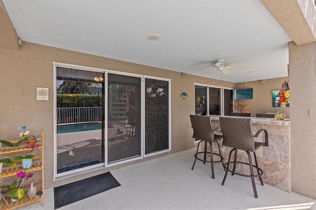 2050 N Pointe Alexis Dr, Tarpon Springs, FL 34689 - view of patio with a ceiling fan and outdoor dry bar