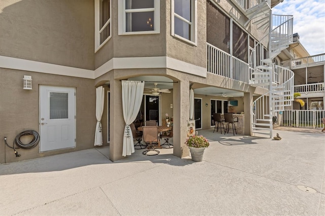 2050 N Pointe Alexis Dr, Tarpon Springs, FL 34689 - property entrance featuring stucco siding and a patio area