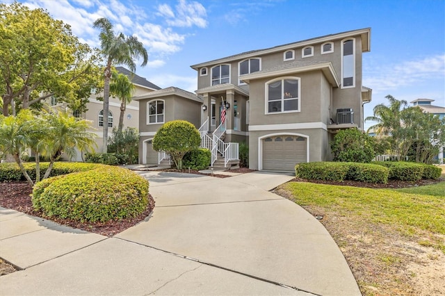 2050 N Pointe Alexis Dr, Tarpon Springs, FL 34689 - view of front facade with stucco siding, an attached garage, and concrete driveway