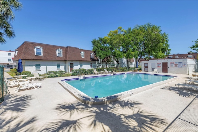 9105 W Hillsborough Ave Unit I102, Tampa, FL 33615 - community pool featuring fence and a patio